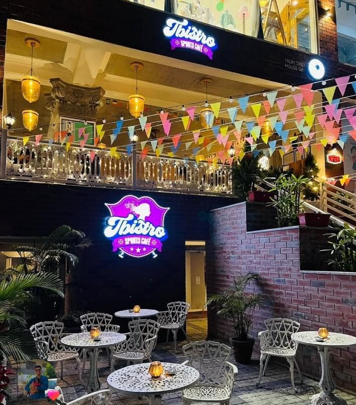 Sports cafe ambience and dining setup at Tbistro